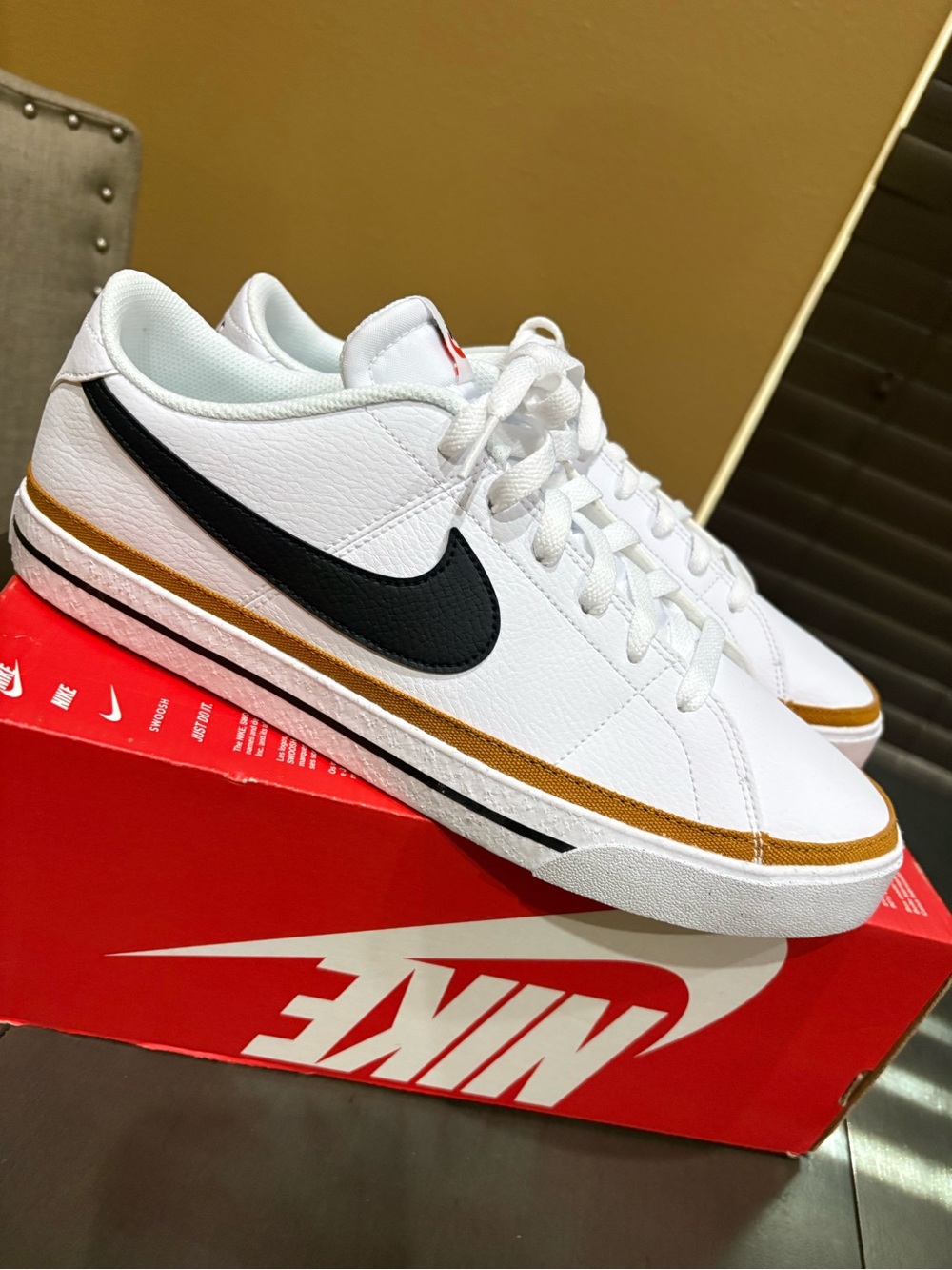 Nike Court Legacy Men’s White Sneakers with Black Swoosh and Gold Stripe